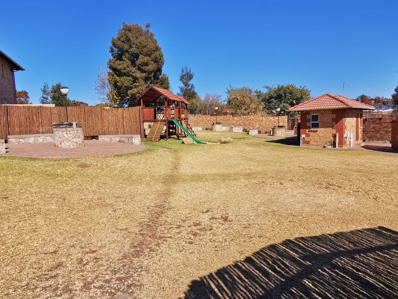The lawn and the children&rsquo;s playground