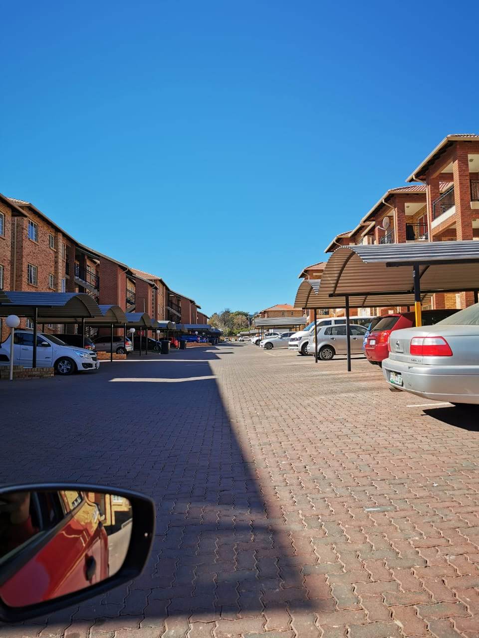 Face-brick walk-ups and covered parking inside Fountain View